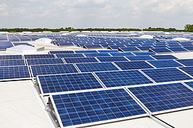 Solar PV modules mounted on a flat roof.